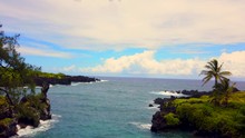 Pan Of Beautiful Keawaiki Bay With Blue Pacific Ocean, Black Lava Rocks On Road To Hana, Maui, Hawaii 4k ProRezHQ.mov