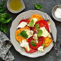 Wall Mural - salad of tomato, mozzarella and basil. Italian food.