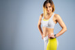 © fotofabrika - Young sporty fit caucasian female model  on gray background