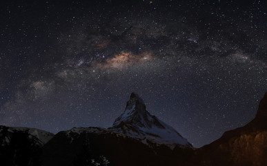 panoramic matterhorn mountain at night in switzerland with starry sky and milky way