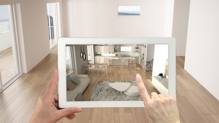 Wall Mural - augmented reality concept. hand holding tablet with ar application used to simulate furniture and de