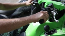 Slow Motion Shot Of Someone Gripping The Handle Bars Of A Quad (ATV, Four-wheeler)