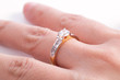 © superbphoto95 - Close up of elegant diamond ring on the finger with white background. Diamond ring.