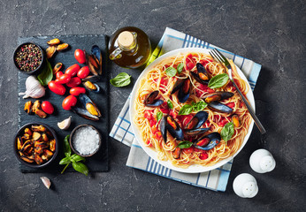 Canvas Print - pasta with seafood on a white plate