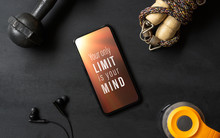 Your Only Limit Is Your Mind. Inspirational Motivational Quotes Fitness Healthy Goals With Mockup Mobile Phone On Grunge Black Table With Dumbbells, Jump Rope, Bottle Of Water. Mock Up Smartphone.