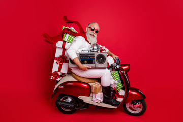 Poster - Profile side view of his he nice attractive cheerful cheery funky bearded gray-haired father delivering carrying desirable purchase discotheque isolated on bright vivid shine red background