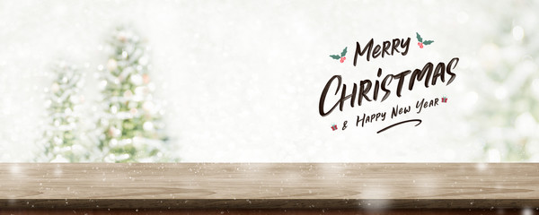 Leinwandbilder - Merry Christmas and happy new year wreath with golden glitter texture over wood table top at blur bokeh christmas tree decor with string light background,Winter holiday greeting card.