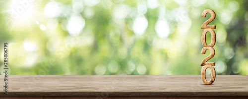 New Year 2020 Wood Number 3d Rendering On Wooden Table At Blur