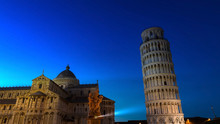 Beautiful View With Blue Sky In The Night Scene At Pisa Cathedral (Duomo Di Pisa) With Leaning Tower  (Torre Di Pisa) Tuscany, Italy.The Leaning Tower Of Pisa Is One Of The Main Landmark In Italy.