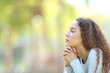 © Antonioguillem - Serious mixed race woman meditating outdoors