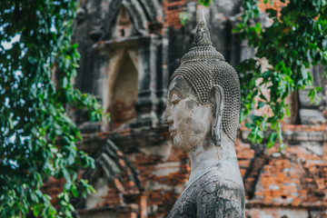 Amazing details of the Wat Maha That temple with the ruins of the Buddha statues.  UNESCO Worl Heritage site.