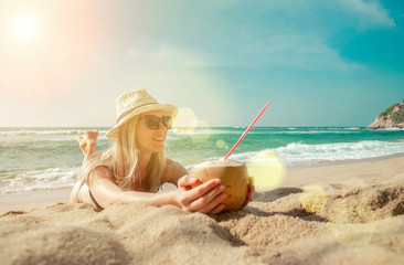 Happy Young Tourist  Smiling Caucasian Woman in hat with coconut