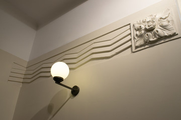 Lamp on the wall with art deco pattern