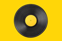 Vinyl Record On A Colored Background. Old Vintage Vinyl Record Isolated On Yellow Background