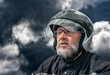 © Radnatt - portrait of elderly motorcyclist on gloomy dark cloudy day