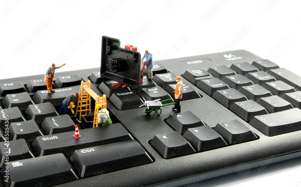 Spoon Computer Hack little figures try to hack the computer system Stock Photo | Adobe Stock