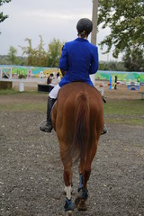 young woman riding a horse