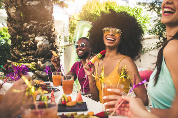 Wall Mural - Happy woman smiling at the camera having fun with friends outdoor at the restaurant