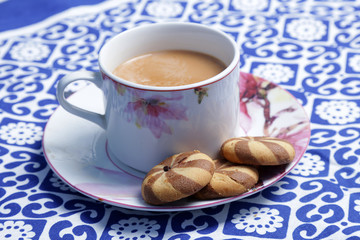  tea and biscuit. A cup of traditional English tea with biscuit.