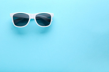 Sticker - Modern sunglasses on blue background