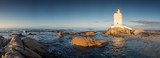 Fototapeta  - Wide angle panoramic image of the Stompneusbaai lighthouse near Shelley point in town of St Helena Bay on the West coast of South Africa
