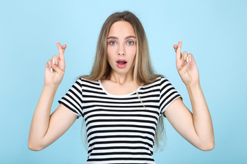 Beautiful young woman on blue background