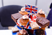 Great Britain Uited Kingdom Union Jack Flag On A Table With Cakes And Muffins. British Or English Party