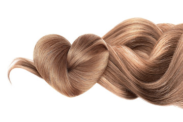 brown hair in shape of heart isolated on a white background