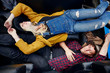 © Trinette Reed/Stocksy - Millennial couple napping in the back of their truck on a road trip