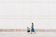© Alina Hvostikova/Stocksy - Girl leading mother on street