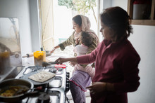 Two Women Cooking Breakfast In Pakistan