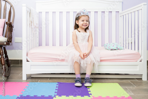 Fotografía Happy Small Princess Sitting On Couch At Home