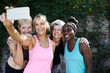 © Ivan Gener/Stocksy - Senior ladies taking selfie outdoors after workout.