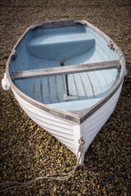 A White And Blue Rowing Boat