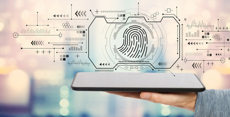 Wall Mural - Fingerprint scanning theme with man holding a tablet computer