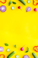 Wall Mural - colorful vegetables frame for cooking design on yellow background top view mockup