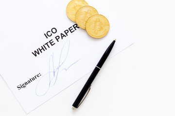 White paper ICO, coins, pen on white background top view