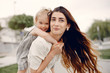 © hetmanstock2 - Mother with daughter. Family in a park. Cute little girl