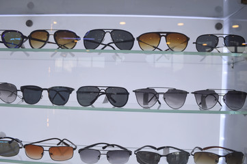 colorful ultraviolet ray protected sun glasses are decorated in a shopping mall of city