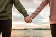 © Алина Бузунова - Couple holding hands outdoor on sunset. Love, family, lovestory, wedding concept