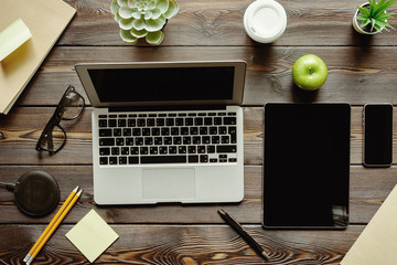 Sticker - Office desk with laptop computer, supplies and green apple, top view