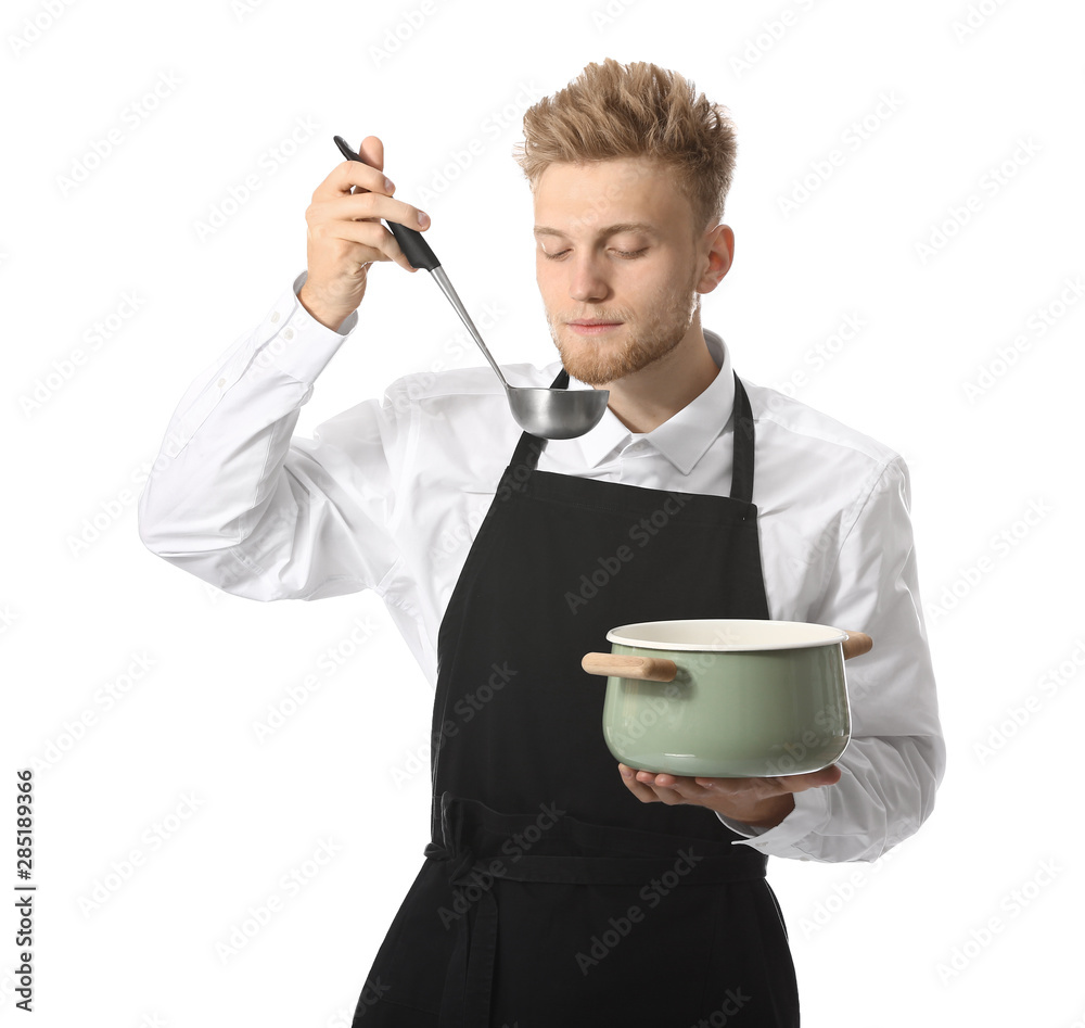 Handsome male chef with soup on white background