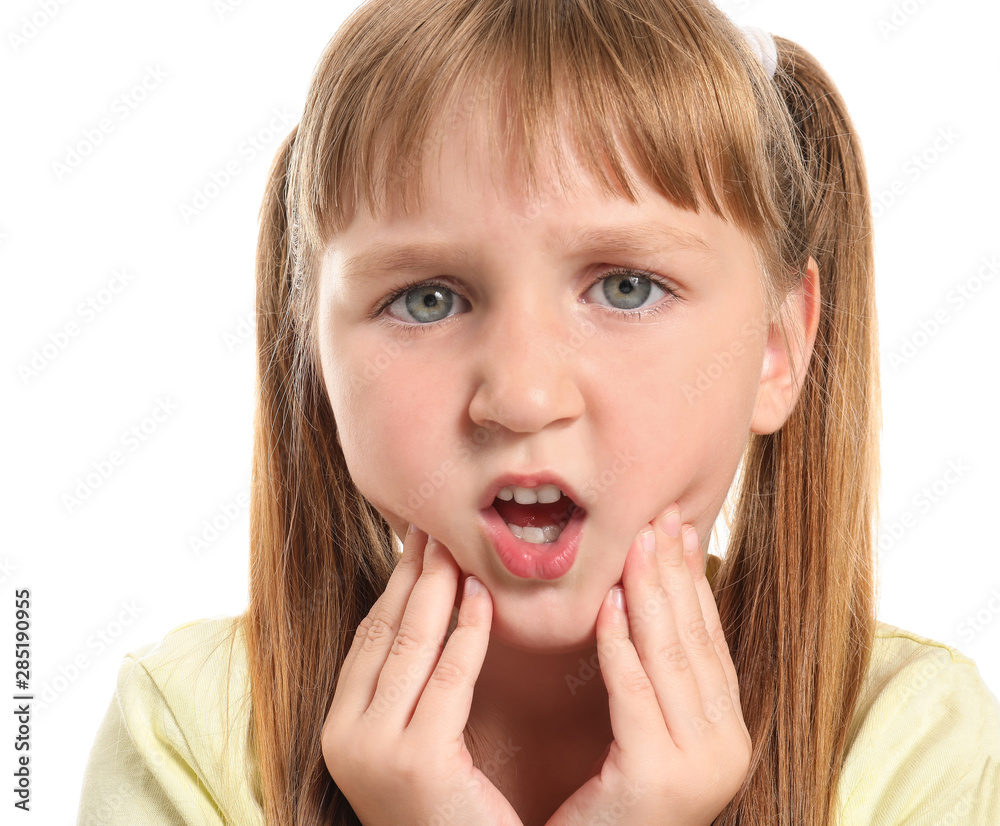 Little girl suffering from toothache on white background