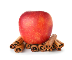 Fresh apple with cinnamon on white background