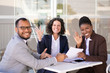 © Mangostar - Happy successful business team posing at table and waving hello. Cheerful multiethnic man and women sitting in outdoor cafe and smiling at camera. Team success concept