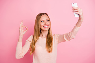 Wall Mural - Portrait of cute lovely girl have ads advertise make photo moments isolated over pink background