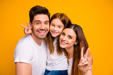 Poster - Close-up portrait of three nice attractive charming cute lovely cheerful cheery optimistic person spending weekend showing v-sign isolated over bright vivid shine yellow background