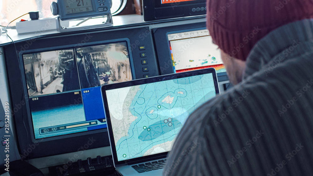 Captain of Commercial Fishing Ship Surrounded by Monitors and Screens ...
