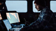 © Gorodenkoff - Shot of a Serious Captain on a Commercial Fishing Ship Surrounded by Monitors and Screens Working with Sea Maps Pilots.
