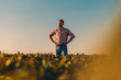© Zoran Zeremski - Portrait of farmer standing in soybean field at sunset.